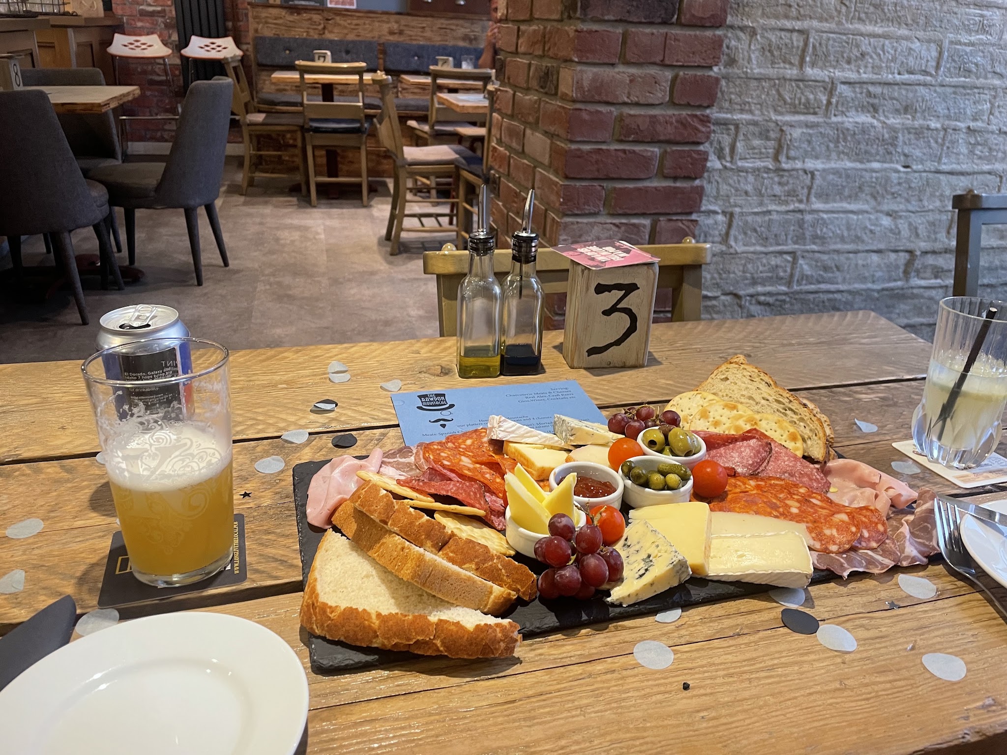 A sharing board on a table in The Tash's relaxed bar interior
