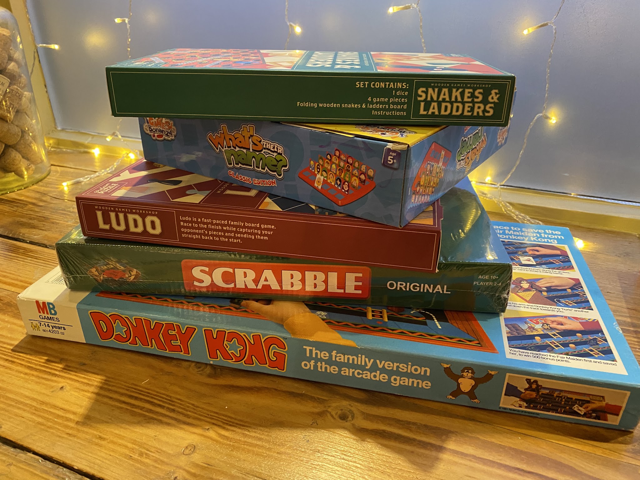 A stack of board games ready to play at The Tash